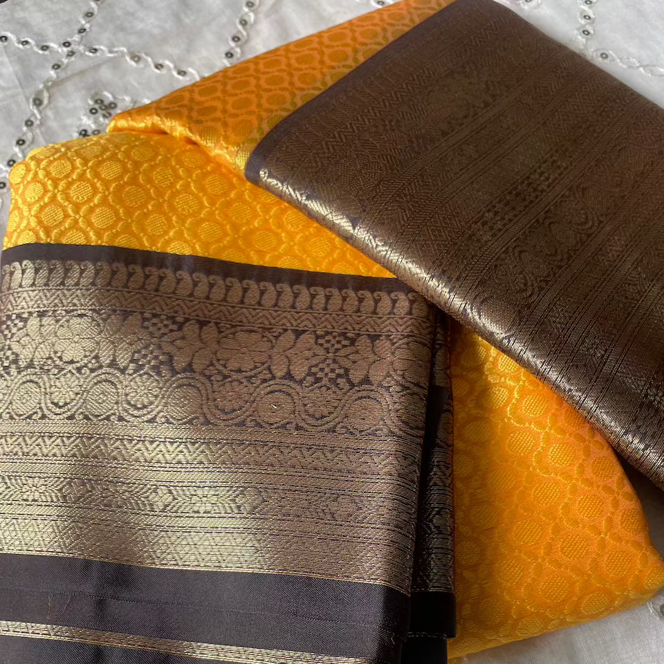 Kanchi Kora Silk Embossed Saree (Mustard Yellow + Navi Blue Border) and Blouse Piece