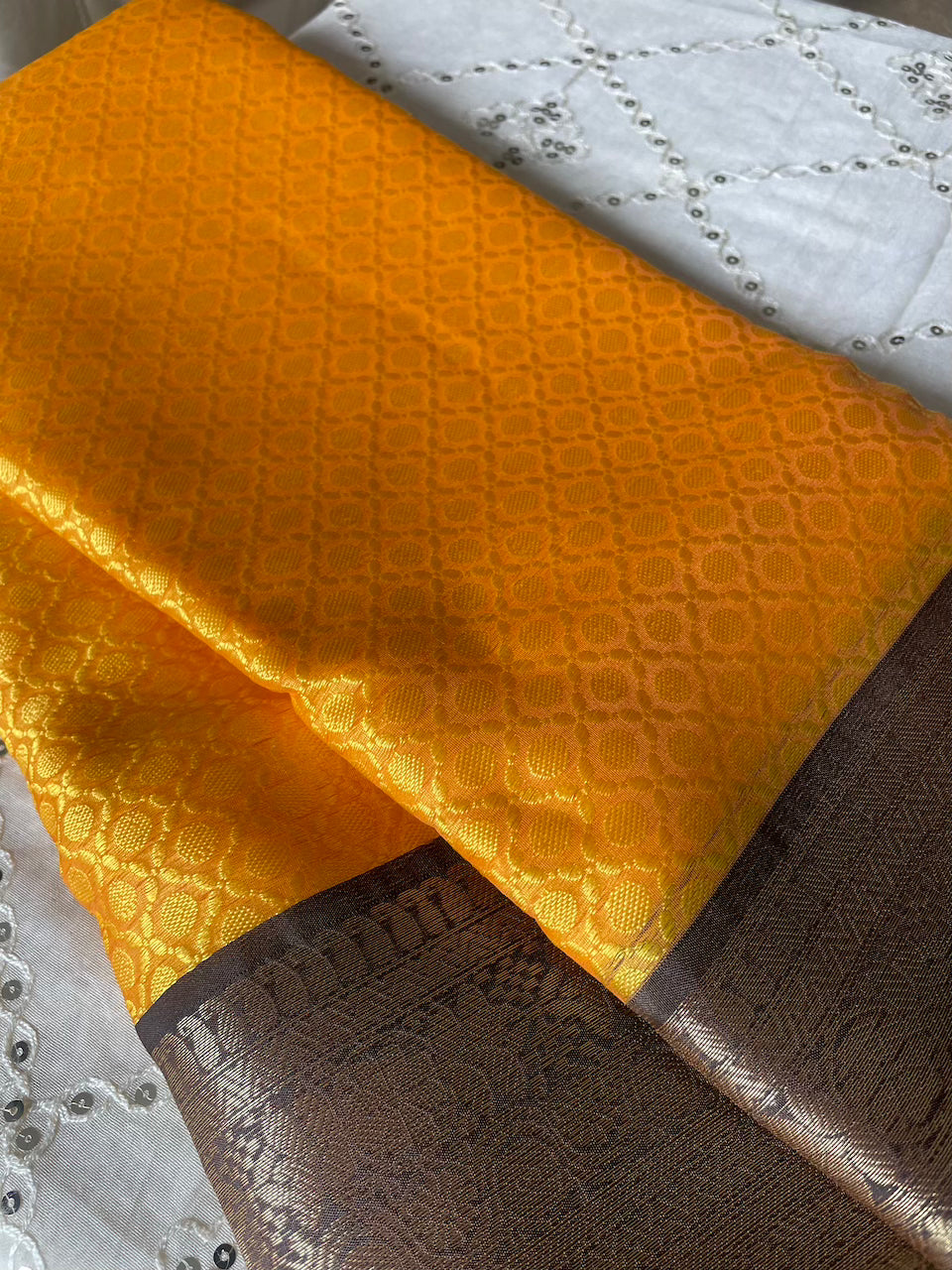Kanchi Kora Silk Embossed Saree (Mustard Yellow + Navi Blue Border) and Blouse Piece